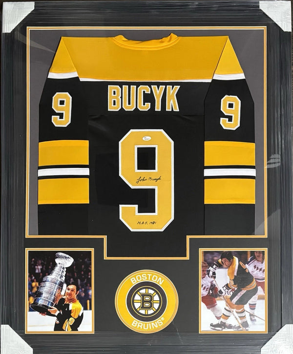 Boston Bruins Johnny Bucyk Signed Framed Black Jersey HOF 1981 With JSA