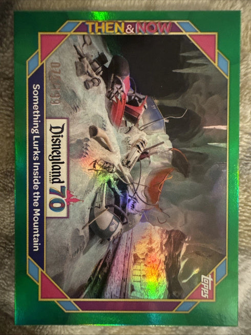 2025 Topps Disneyland 70th #40 Something Lurks Inside The Mountain Green /199