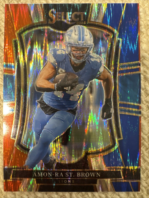 2025 Panini Select - Amon-Ra St. Brown Premier Level Red & Blue Shock #170 Lions